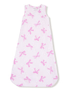White sleep sack with a pink bow pattern, designed for infants. Ideal for comfort and warmth during sleep.