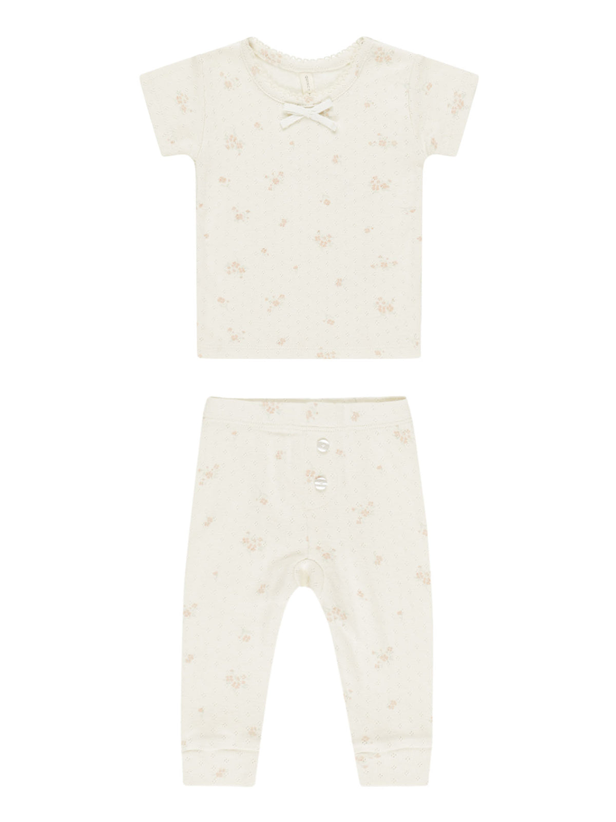 Light cream short-sleeve shirt and pants set with floral print and bow detail. Ideal for infants.