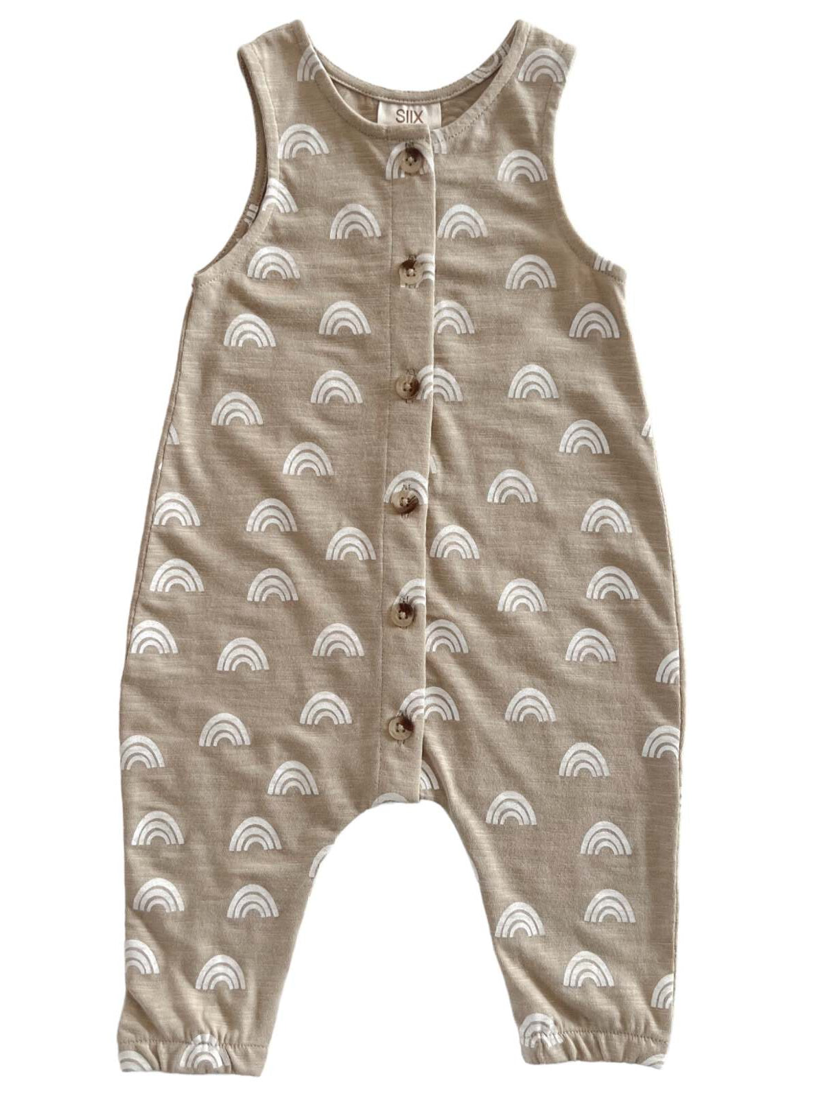 Light brown toddler romper with white rainbow patterns and wooden buttons down the front.