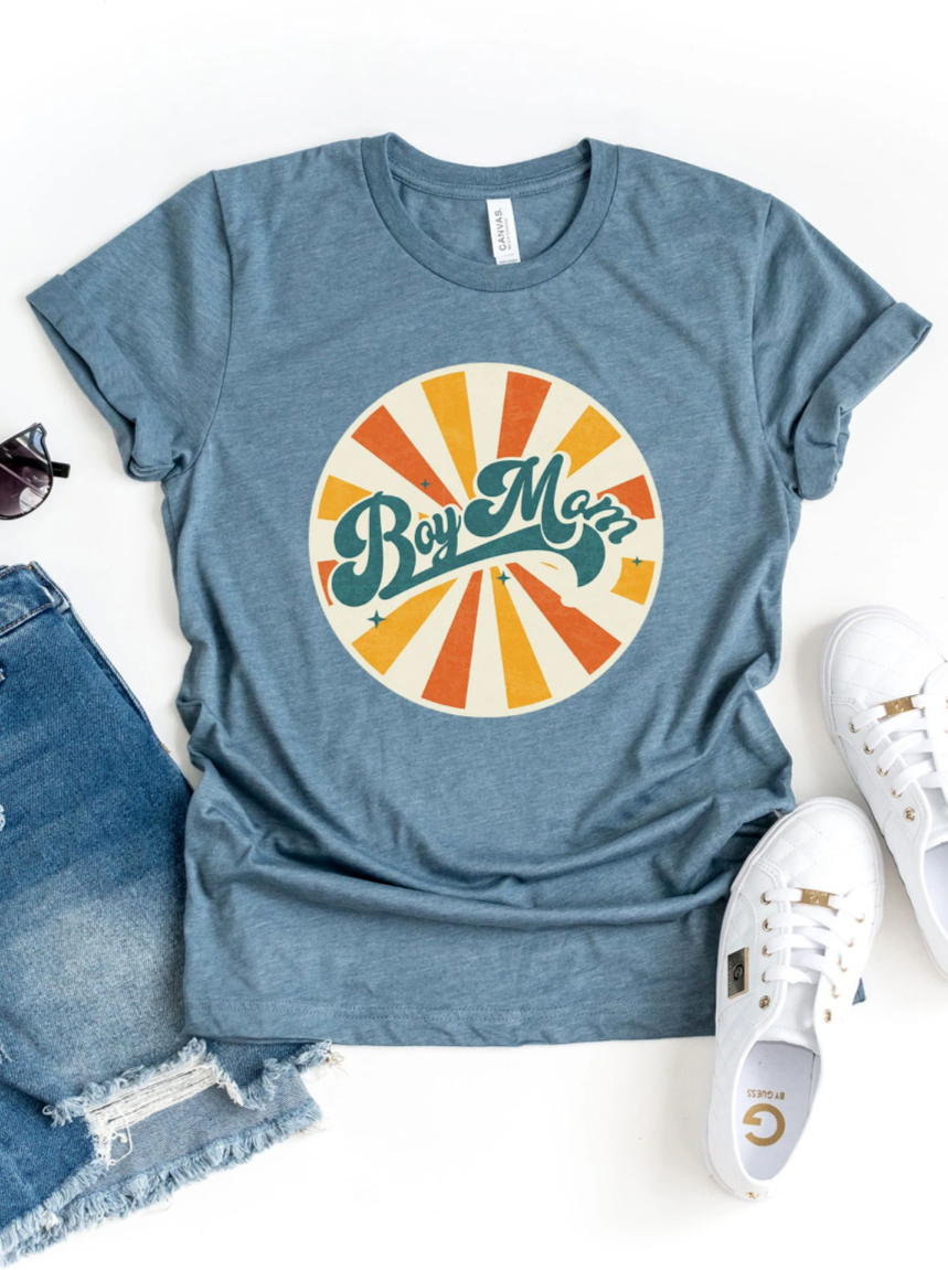 Gray t-shirt with "Boy Mom" graphic, styled with denim shorts and white sneakers, against a white background.