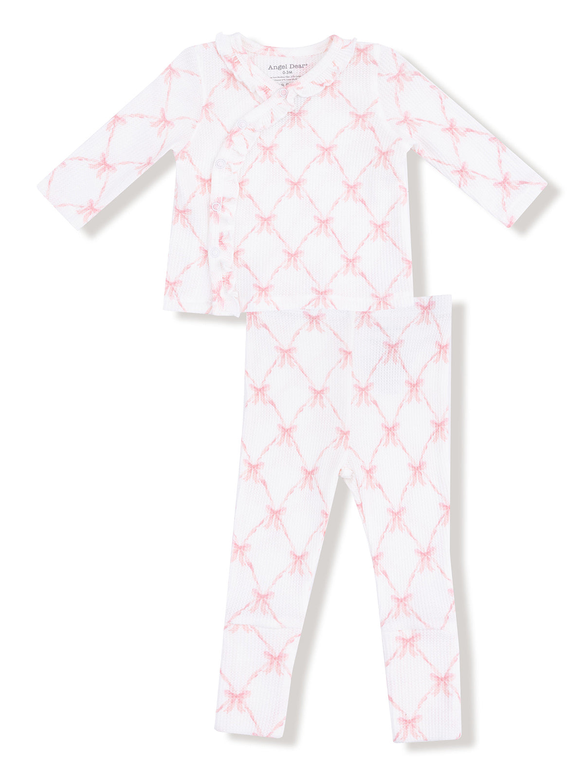 White and pink patterned children's pajama set with long sleeves and leggings.