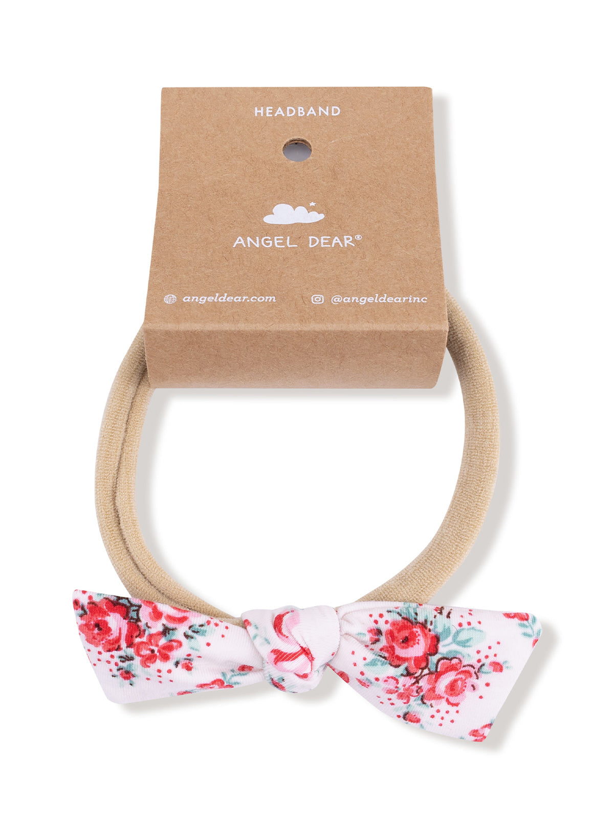 Floral-patterned headband with a beige elastic band and a bow. Displayed on a brown cardboard tag.