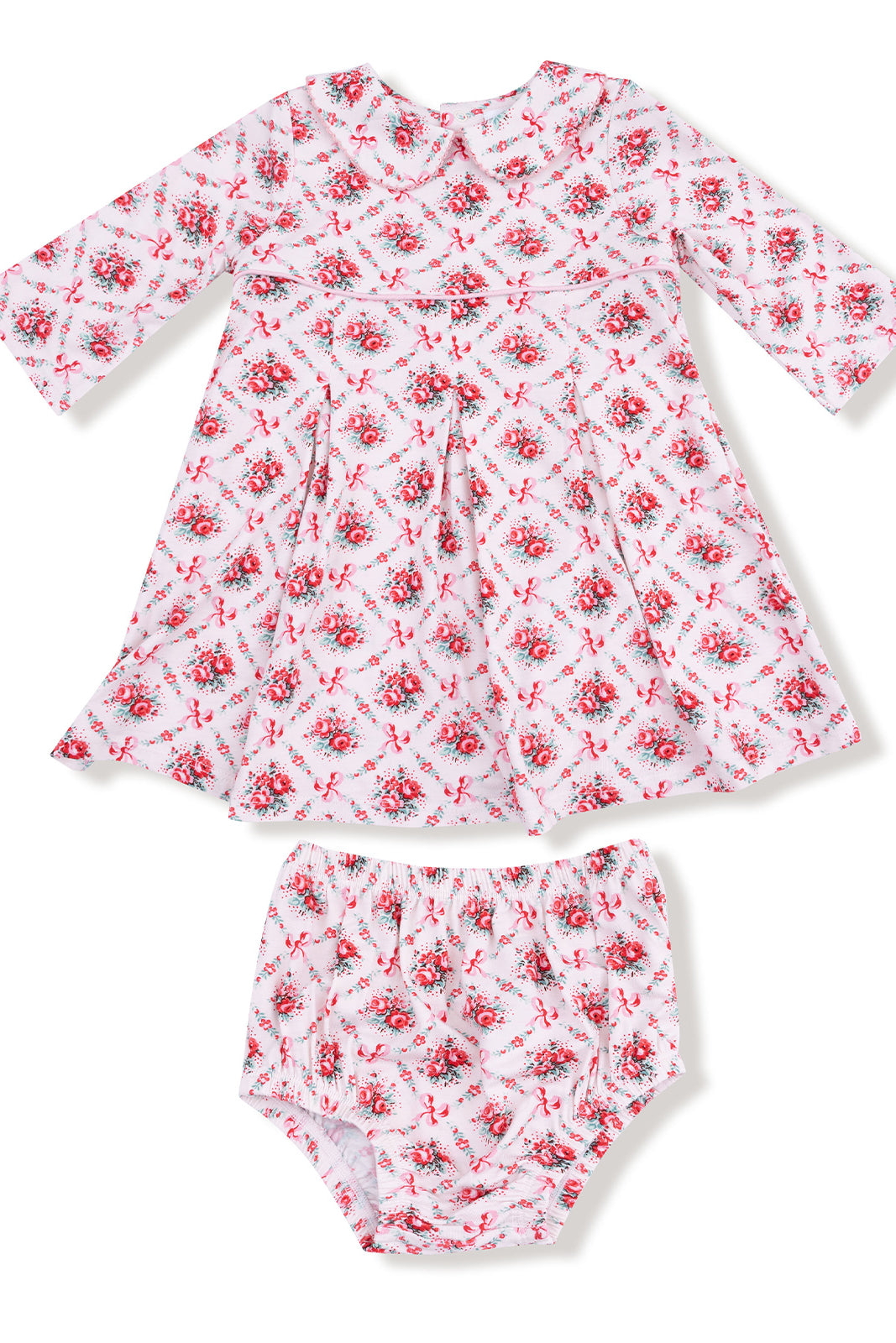 Pink floral dress with long sleeves and matching bloomers, featuring bows and a classic cut. Ideal for young girls.
