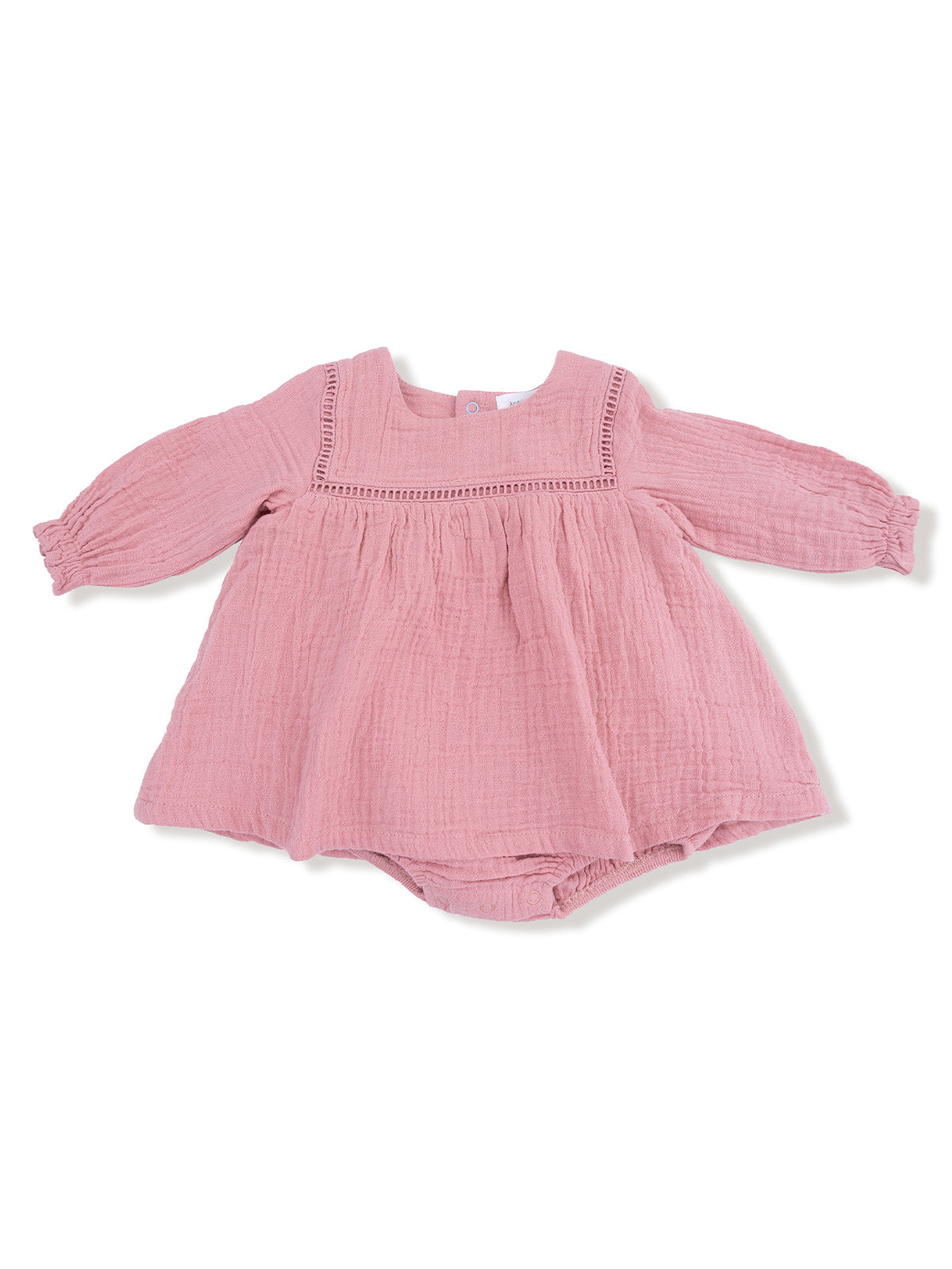 Light pink baby dress with long sleeves and a textured fabric, featuring a decorative neckline.