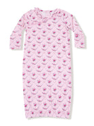 Pink floral nightgown with long sleeves and ruffled neckline, featuring a diamond pattern of small roses.