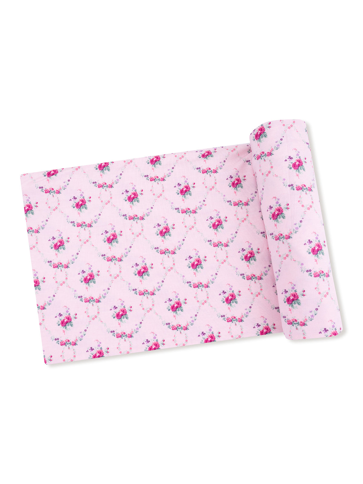 Pink fabric with floral pattern, rolled and unrolled, featuring intricate designs of roses and vines.
