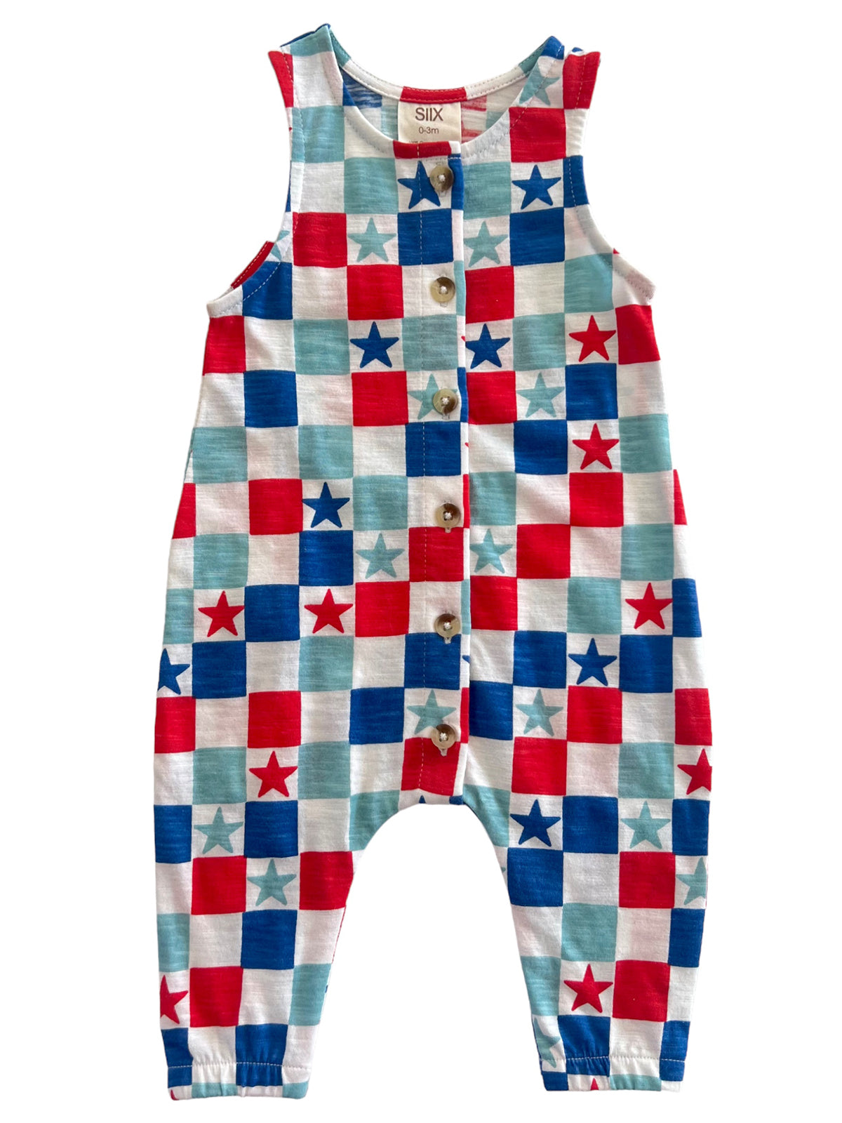 Child's romper featuring a colorful red, white, and blue star pattern with wooden buttons.
