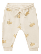 Cream-colored pants with submarine patterns and elastic waistband, suitable for casual wear.