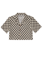 Short-sleeve, cropped shirt with a black and beige checkerboard pattern and wooden buttons.