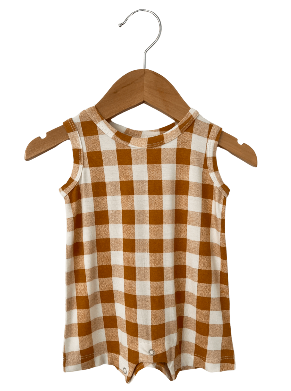 Brown and cream gingham sleeveless onesie hanging on a wooden hanger.