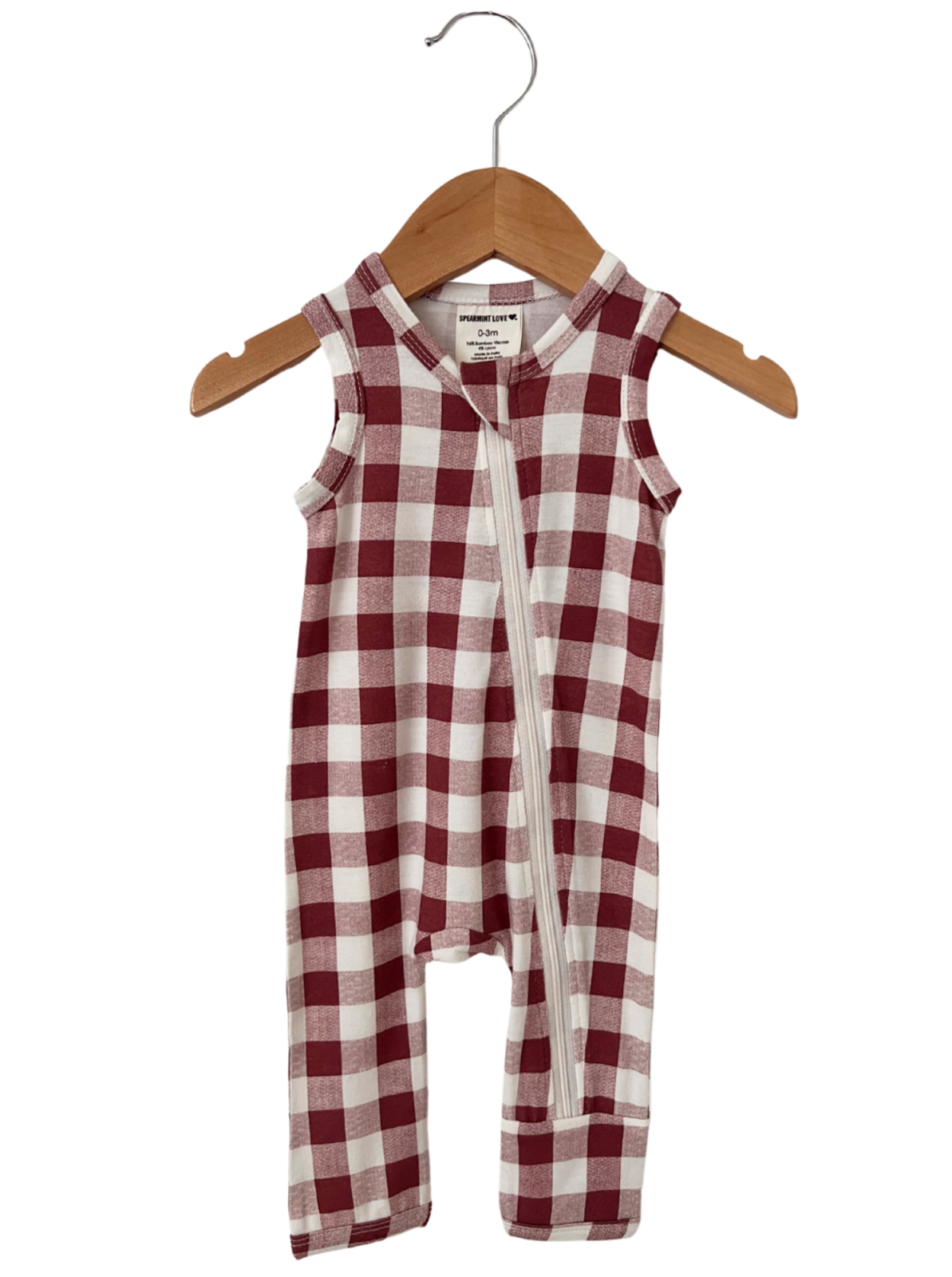 Red and white checkered baby romper on a wooden hanger. Ideal for infants aged 0-3 months.