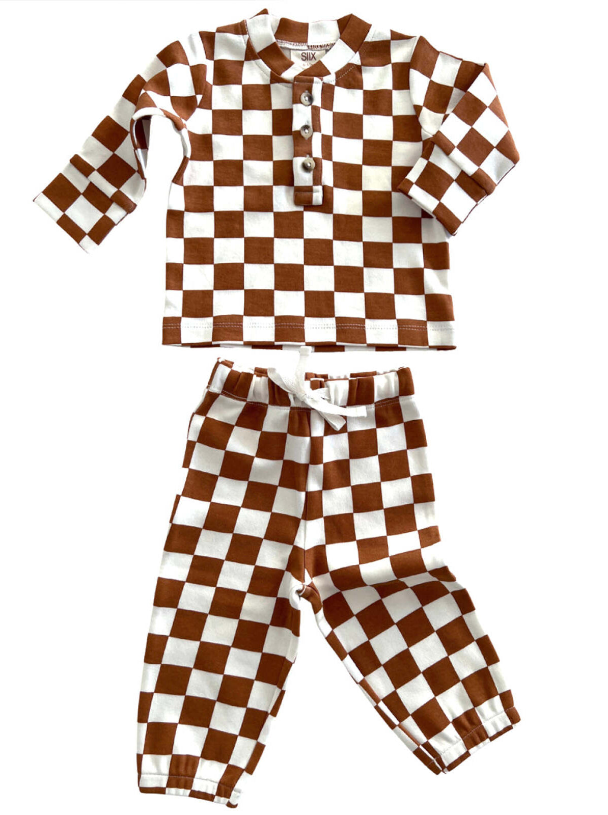 Brown and white checkered toddler pajama set featuring a long-sleeve top and matching pants.