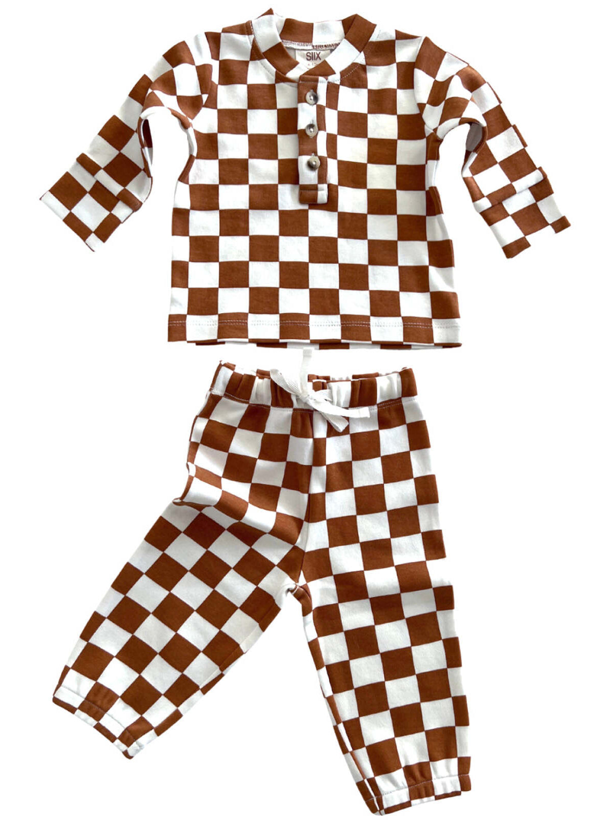 Brown and white checkered two-piece outfit, featuring a long-sleeve top and matching pants.
