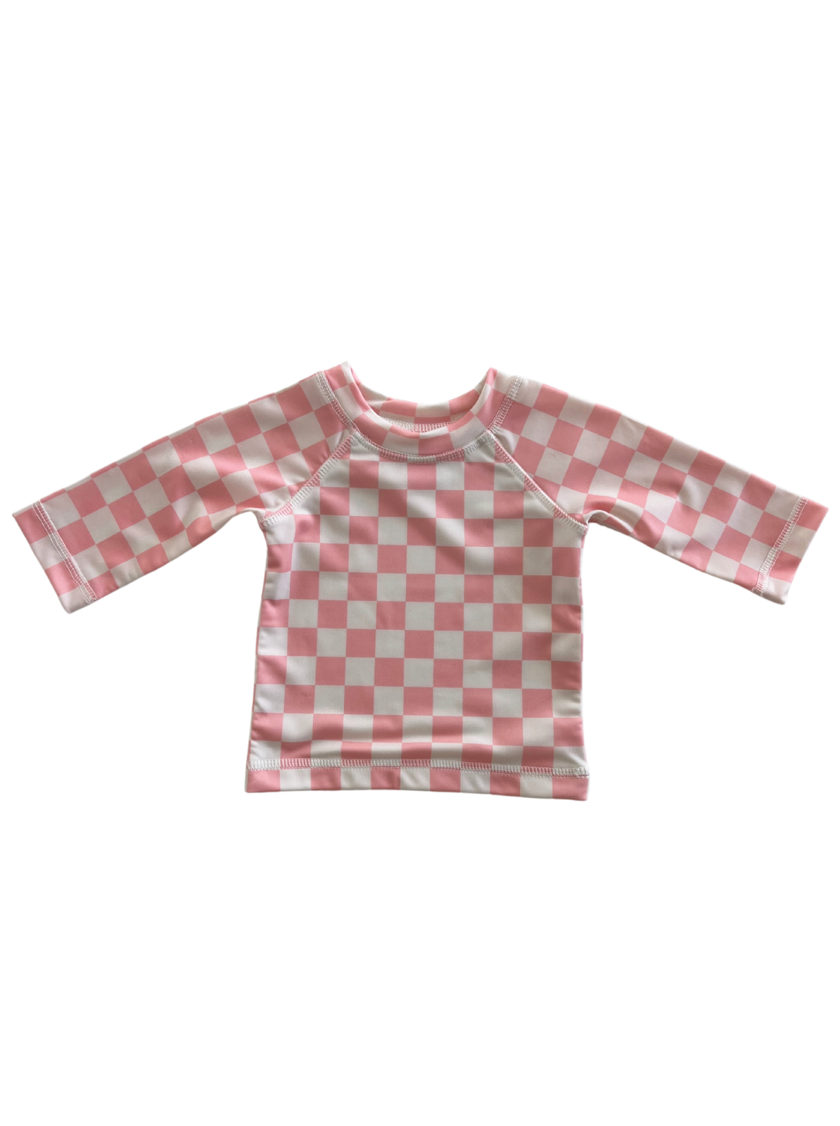 Pink and white checkered long-sleeve children’s shirt on a white background.
