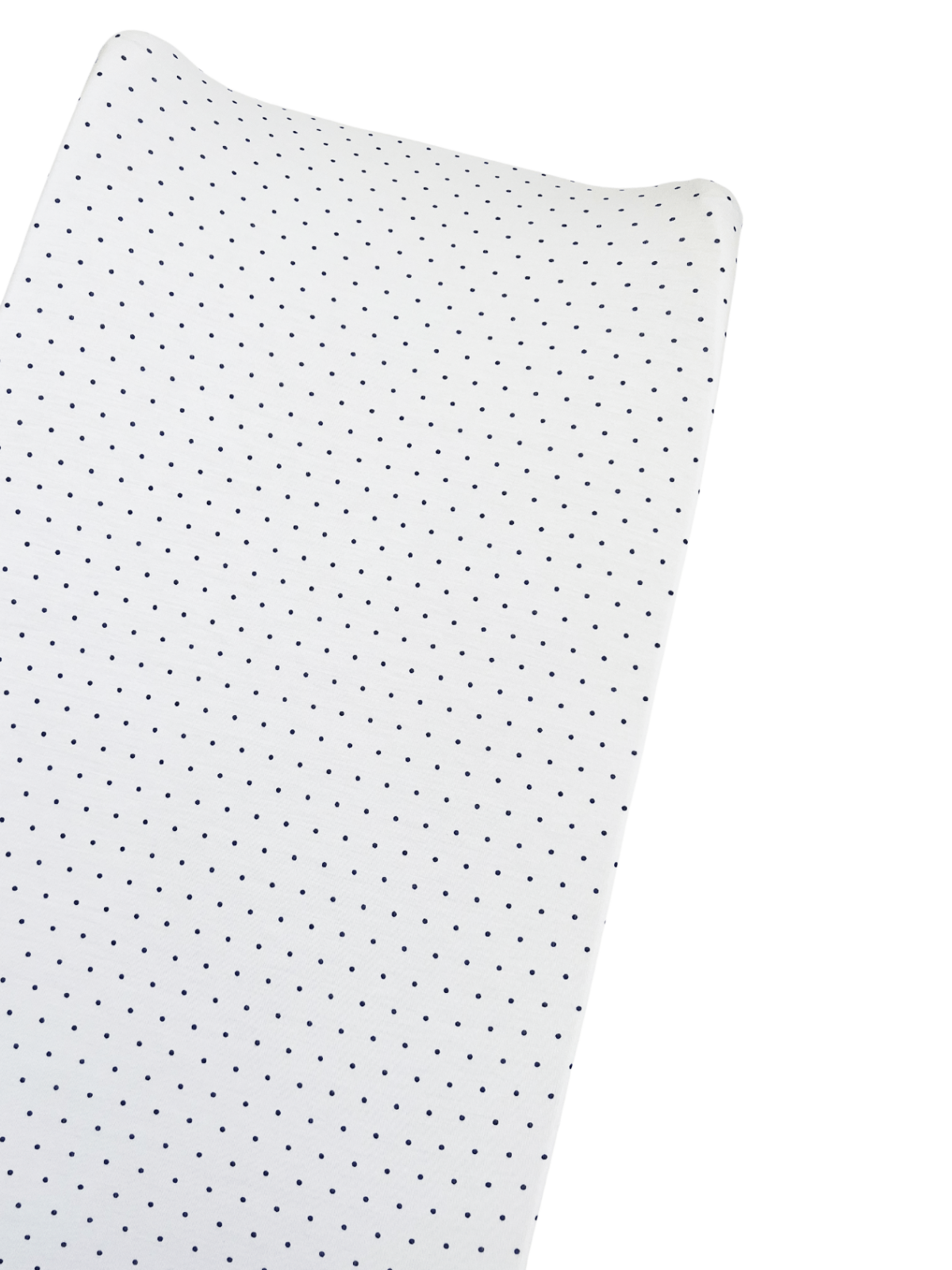 White fabric with a navy blue polka dot pattern, folded at an angle.