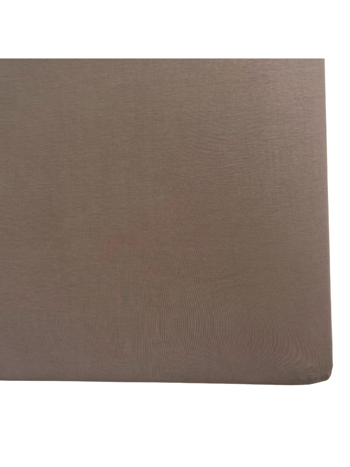 Brown textured fabric covering the corner of a cushioned surface.