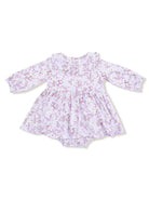 Lavender baby dress with floral print and long sleeves, featuring a round collar and ruffled skirt.