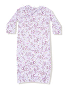 Lavender dress with floral print and ruffled neckline, featuring long sleeves and gathered hem. Perfect for spring.