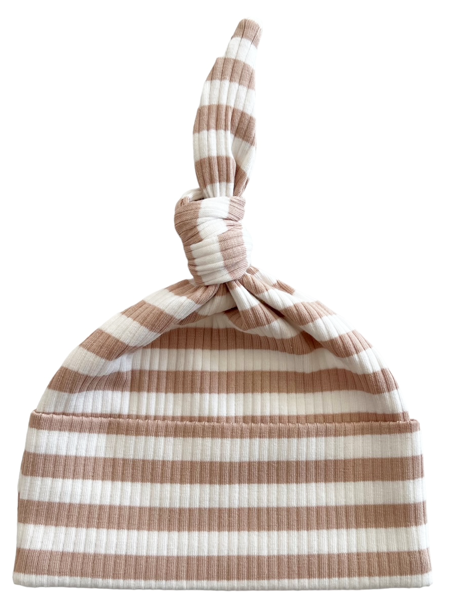 Striped newborn hat in soft beige and white, featuring a cute knot on top. Ideal for infants and stylish baby outfits.
