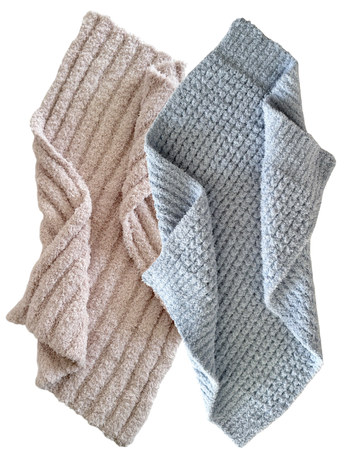 Two cozy blankets, one pink textured and one light blue waffle patterned, draped together.