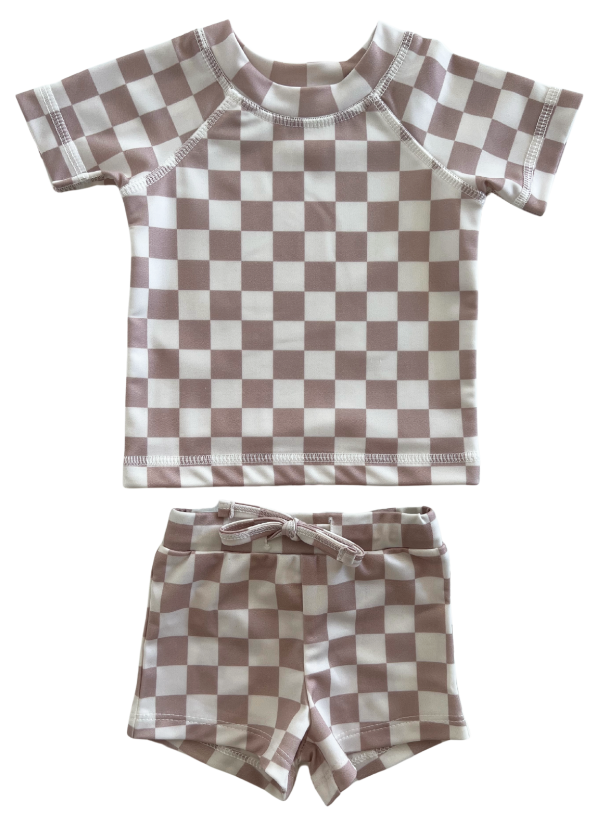 Child's swimwear set featuring a checkered pattern in pink and white, including a short-sleeve top and matching shorts.