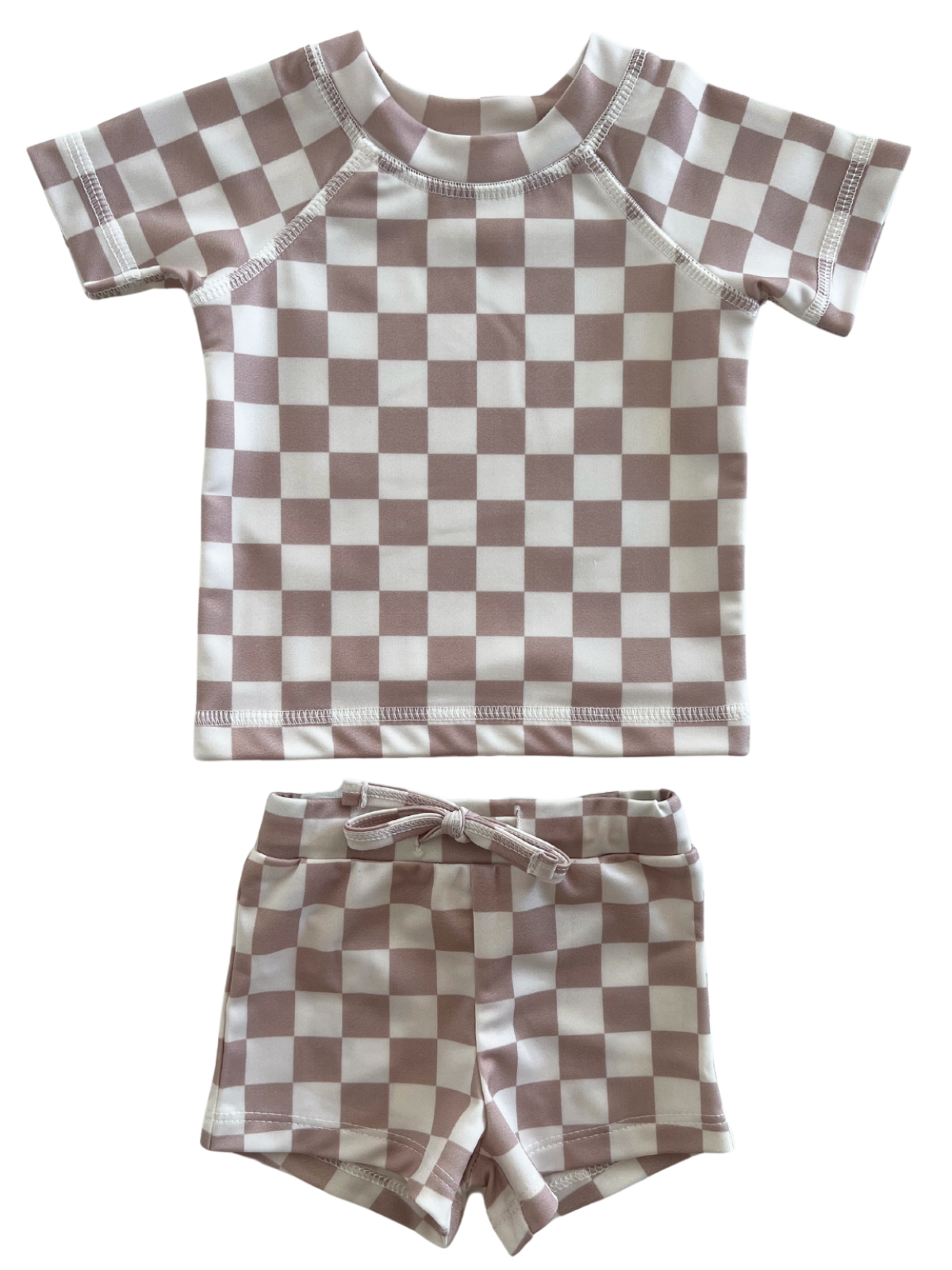 Child's swimwear set featuring a checkered pattern in pink and white, including a short-sleeve top and matching shorts.
