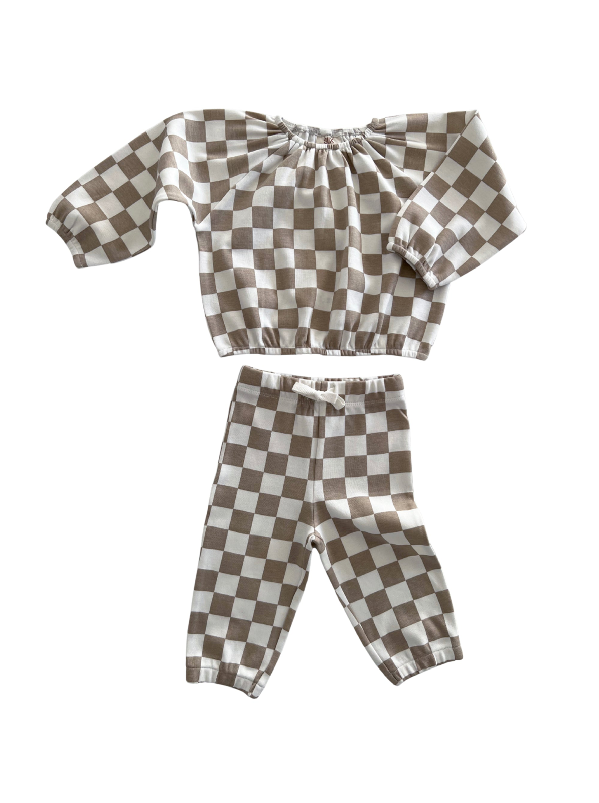 Brown and white checkered children’s outfit with long sleeves and matching pants.