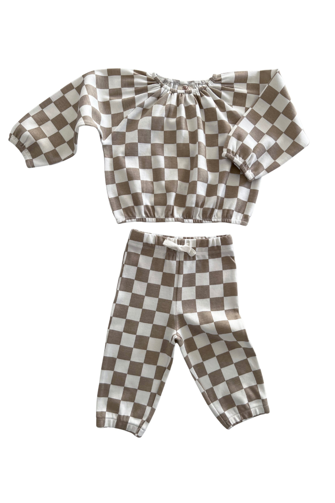 Brown and white checkered children’s outfit with long sleeves and matching pants.