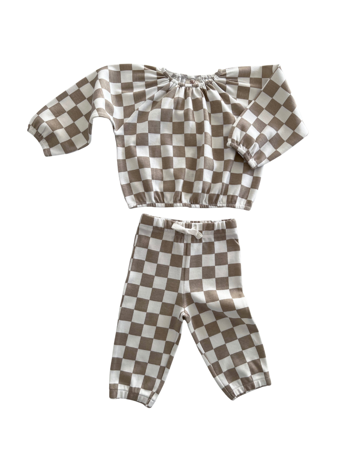 Brown and white checkered children’s outfit with long sleeves and matching pants.