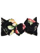 Black floral bow headband with vibrant pink and yellow flowers, soft fabric. Ideal for stylish hair accessories.