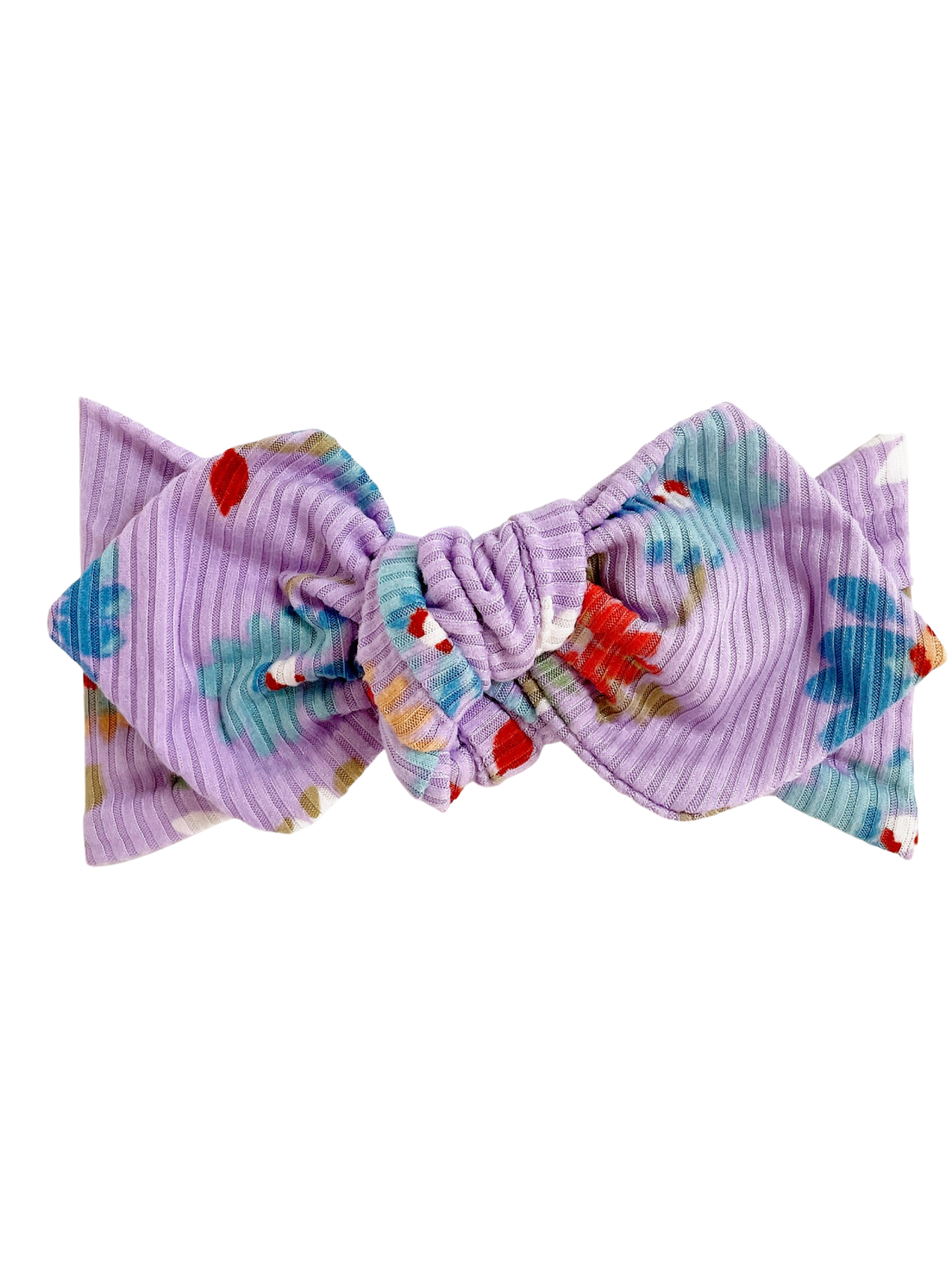 Purple floral hair bow with a knotted center, featuring bright colors and a textured fabric design.