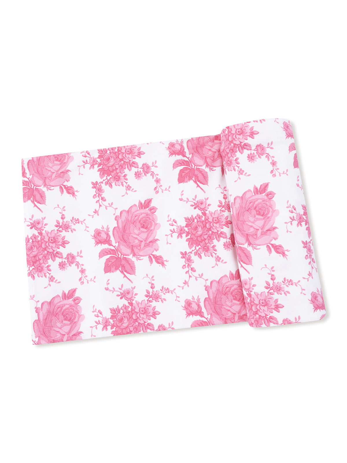 Pink floral fabric with roses and small blossoms on a white background, neatly rolled. Perfect for sewing projects.