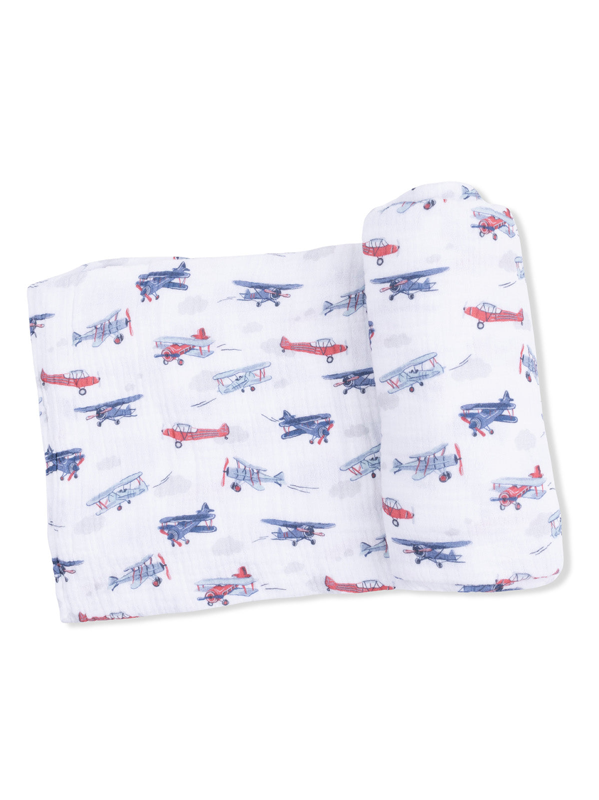 Lightweight blanket featuring a playful pattern of colorful airplanes on a white background.