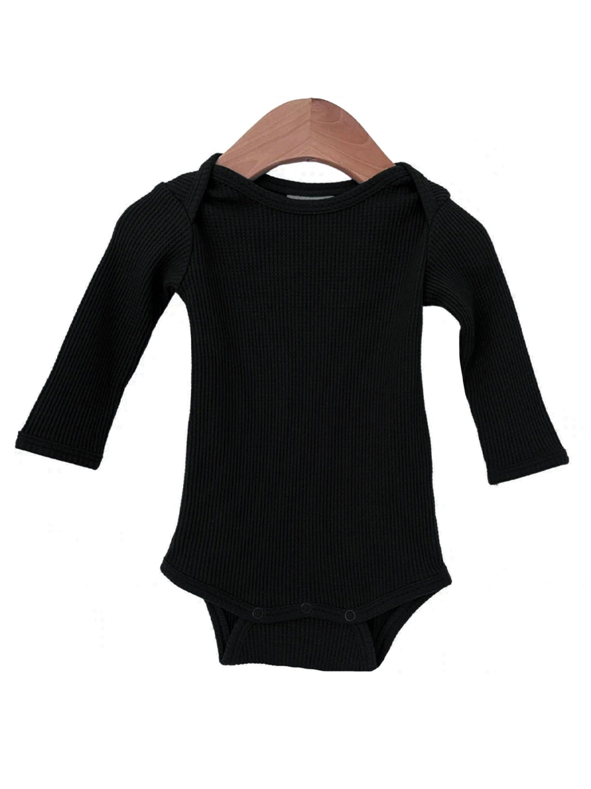 Black long-sleeve baby bodysuit on a wooden hanger against a white background.