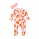 Pink onesie with orange pumpkin print and a matching bow, perfect for Halloween or festive occasions.