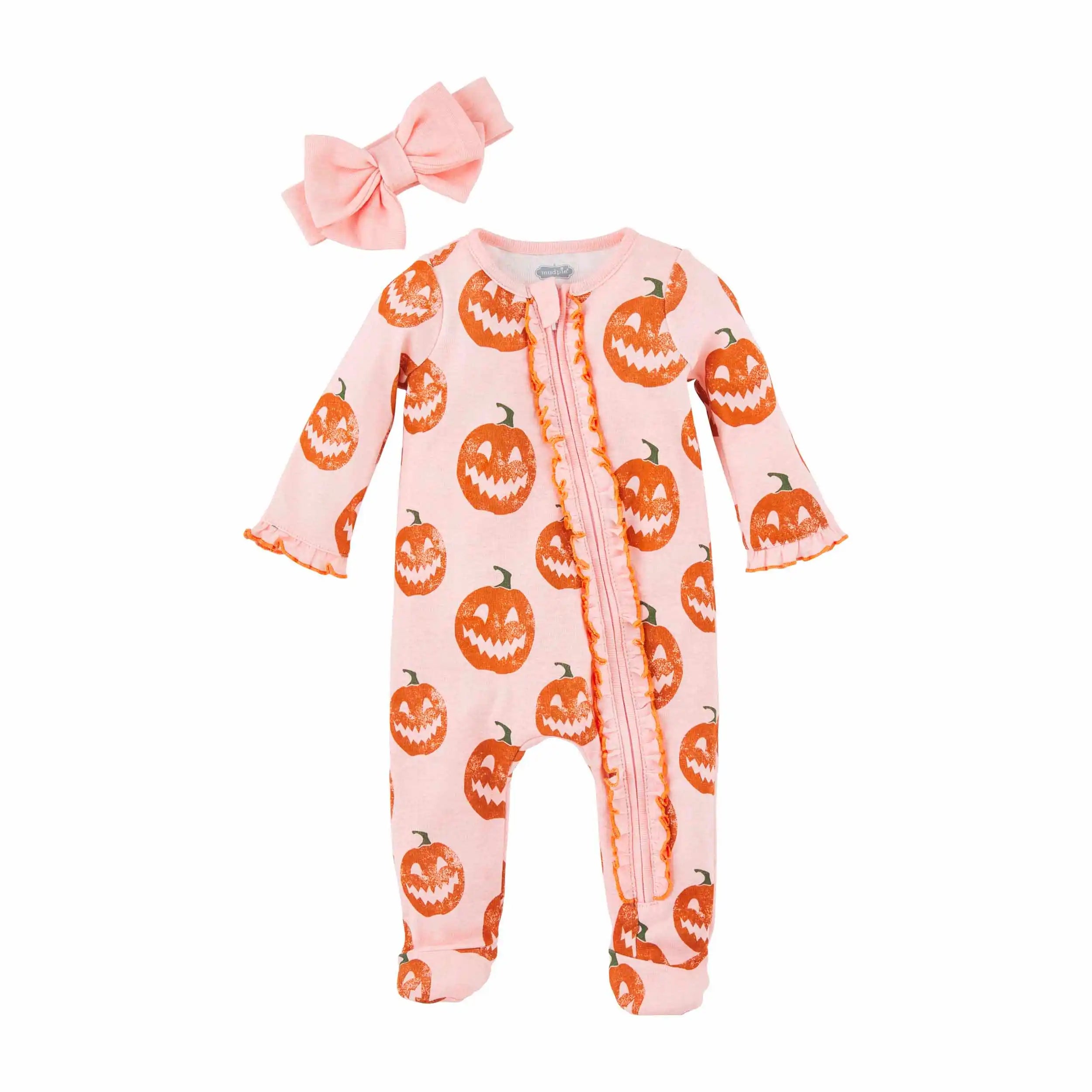 Pink onesie with orange pumpkin print and a matching bow, perfect for Halloween or festive occasions.