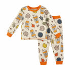 Autumn-themed children's pajamas featuring pumpkins, leaves, and hot drinks on a light background.