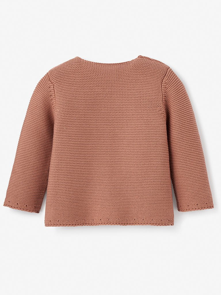 Back view of a textured, long-sleeve, rust-colored sweater on a white background.