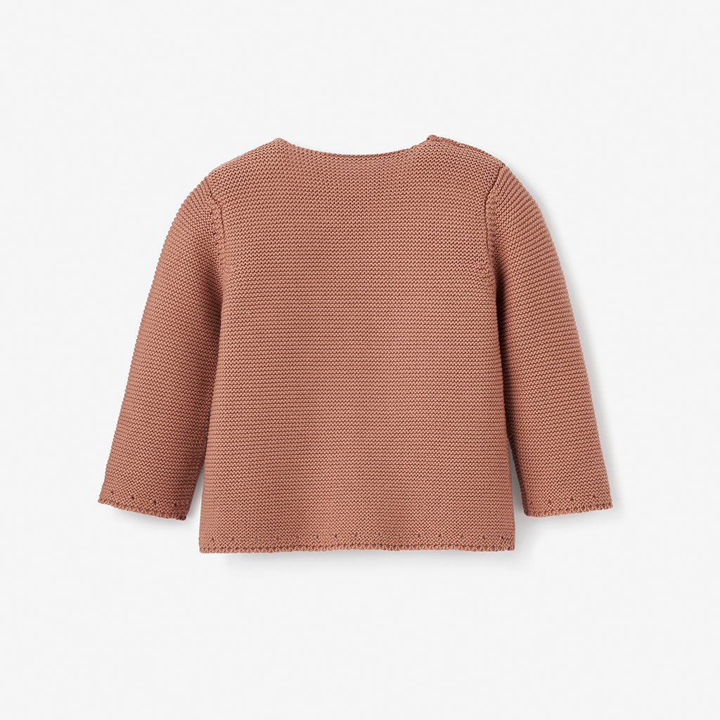 Back view of a textured, long-sleeve, rust-colored sweater on a white background.