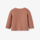 Back view of a textured, long-sleeve, rust-colored sweater on a white background.