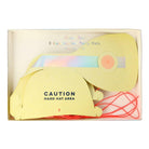 Box of eight yellow construction party hats with "Caution Hard Hat Area" printed on one hat.