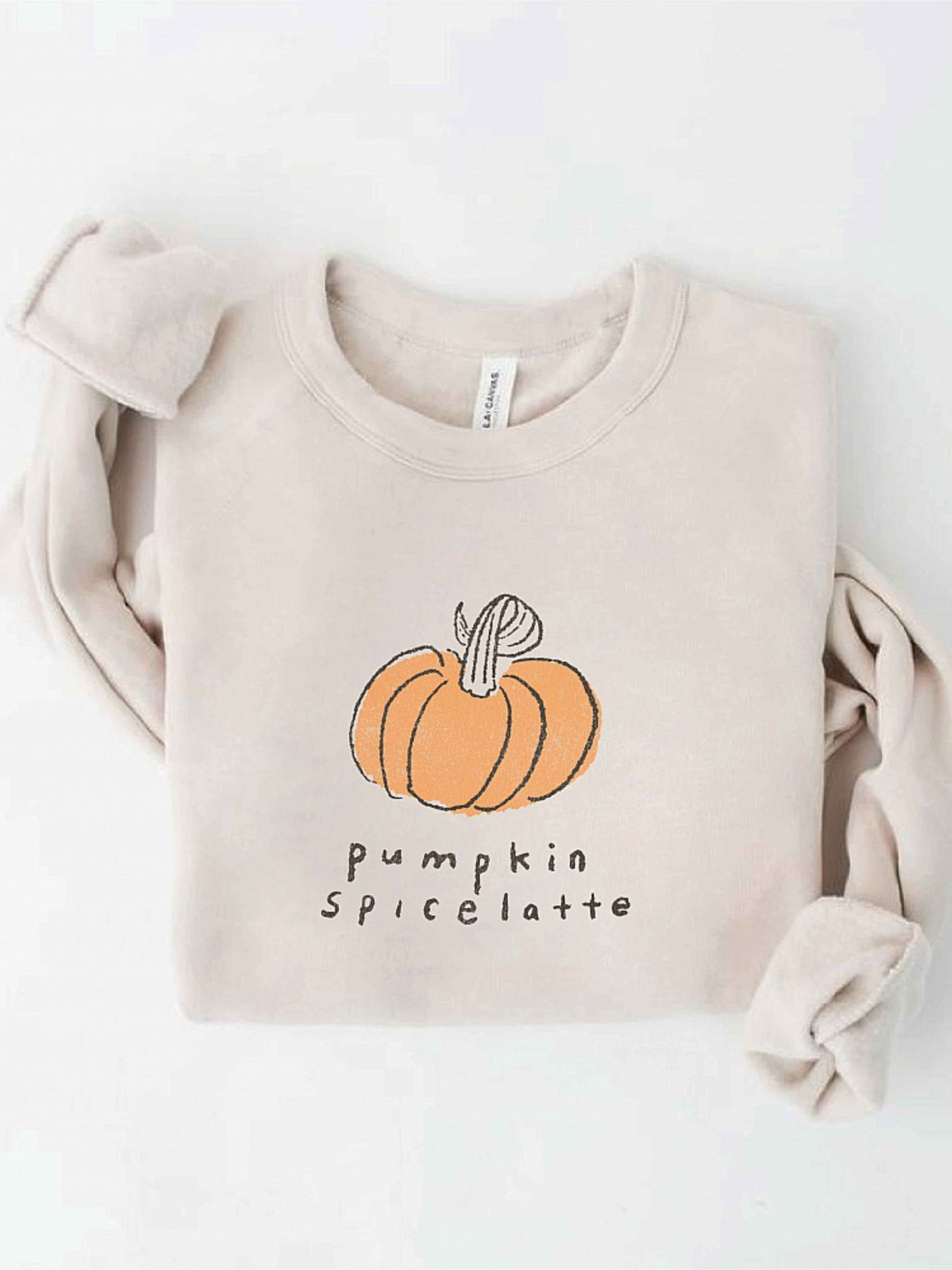 Beige sweatshirt with a pumpkin graphic and "pumpkin spice latte" text underneath. Perfect for fall fashion.