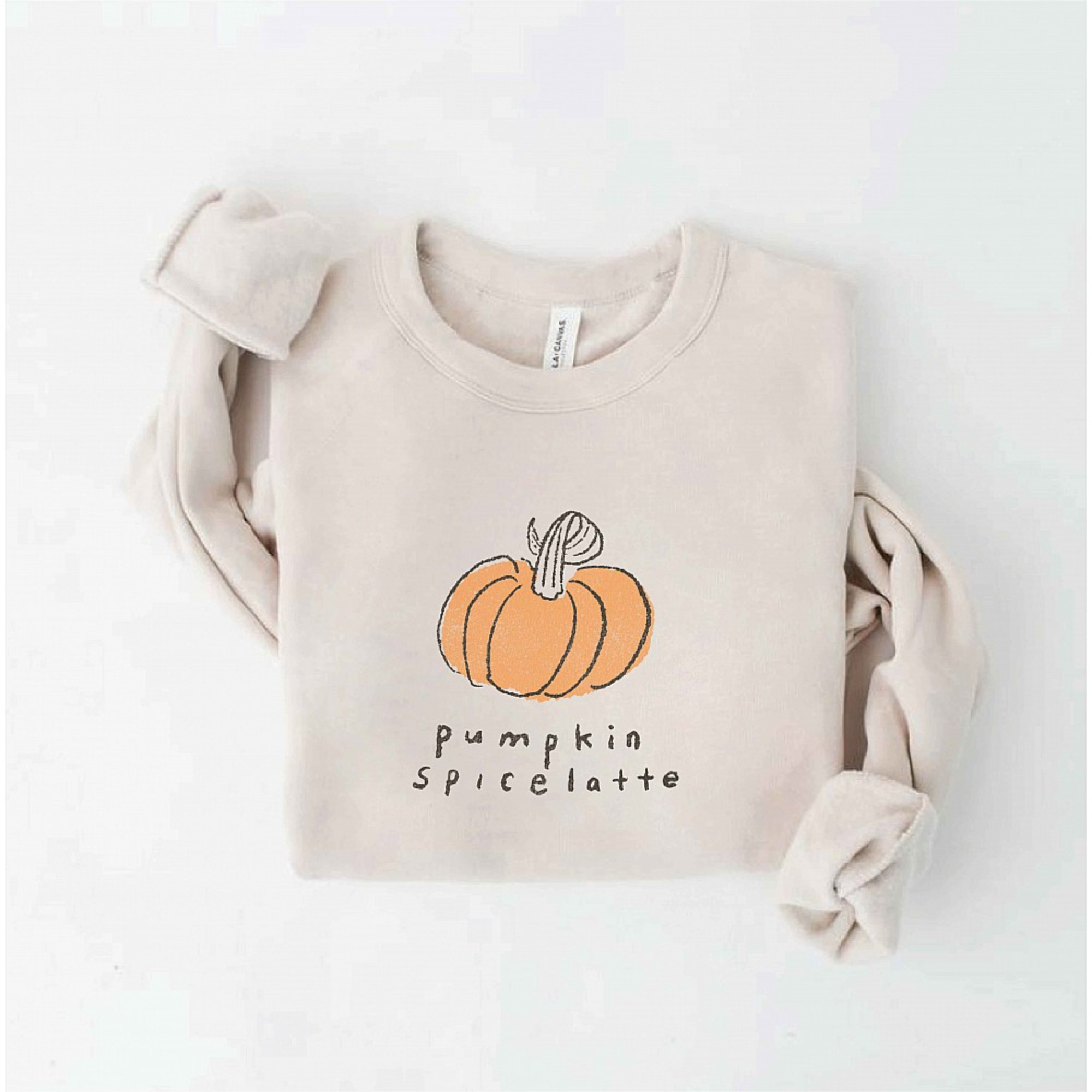 Beige sweatshirt with a pumpkin graphic and "pumpkin spice latte" text underneath. Perfect for fall fashion.