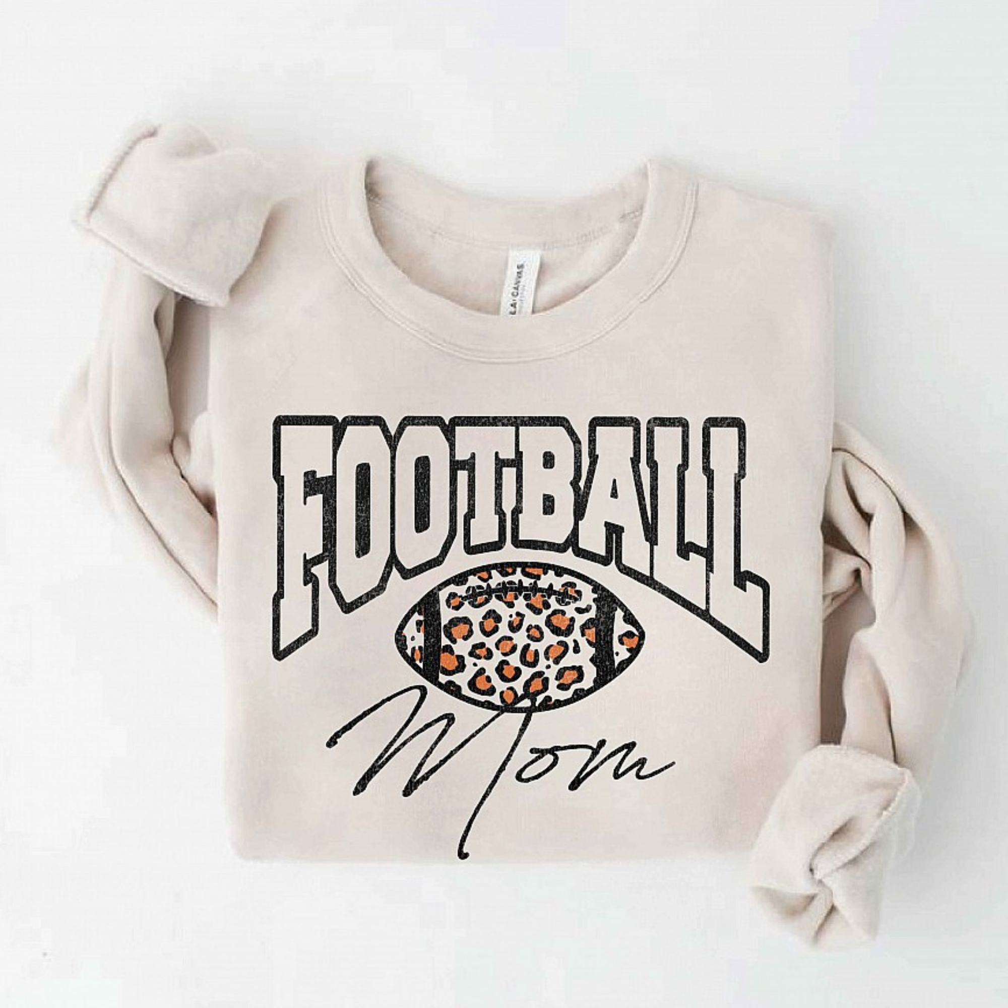 Cream sweatshirt featuring "FOOTBALL Mom" with a leopard print football graphic.
