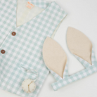 Light blue checkered vest with bunny ears and a decorative pocket watch.