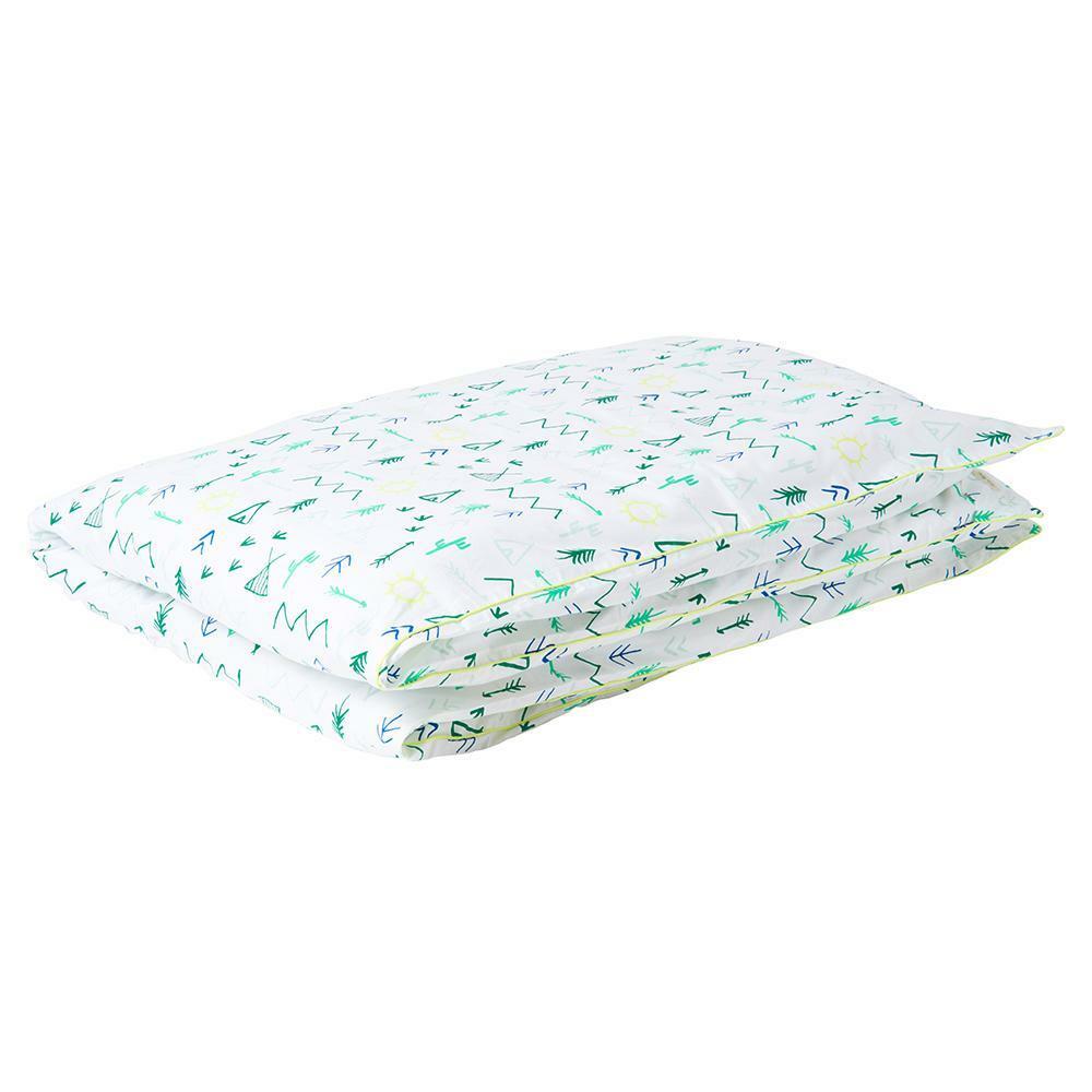Folded bedding with a green and yellow nature-inspired print on a white background.