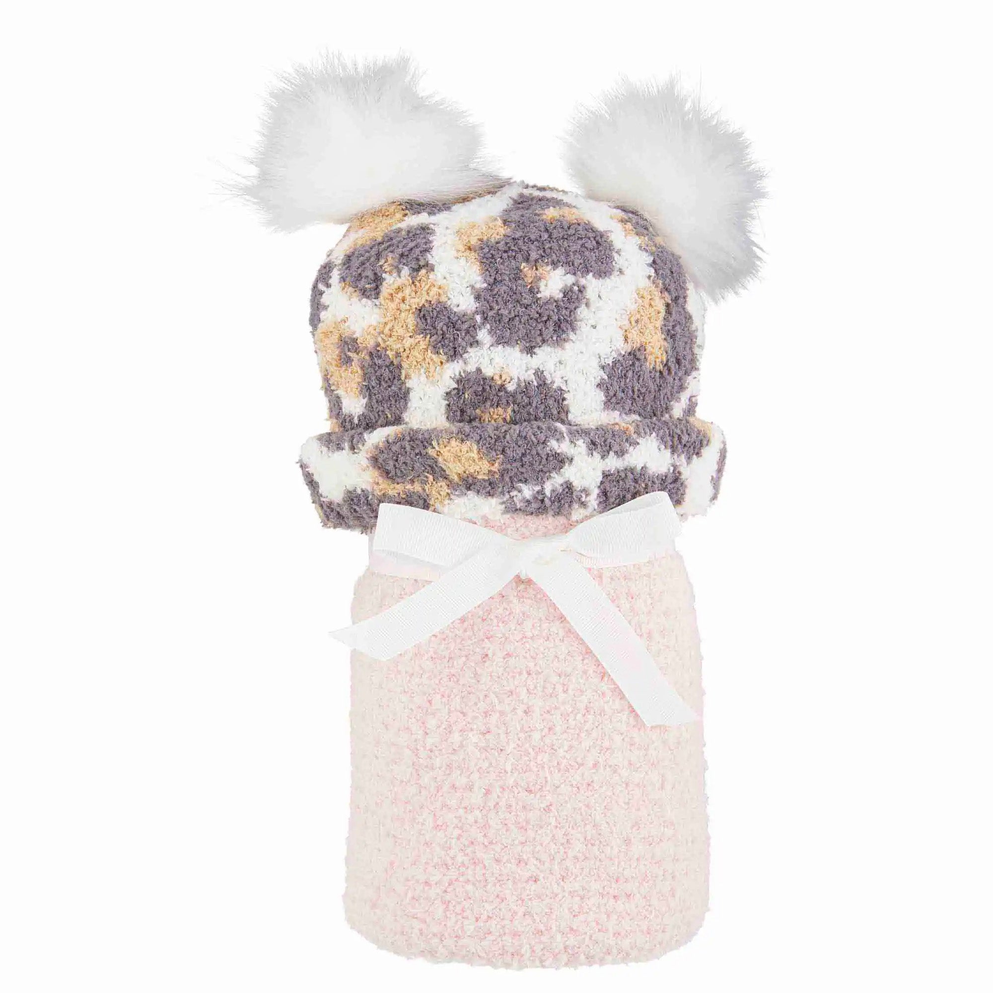 Soft leopard print hat with fluffy pom-poms atop a pink cozy holder, finished with a white ribbon.