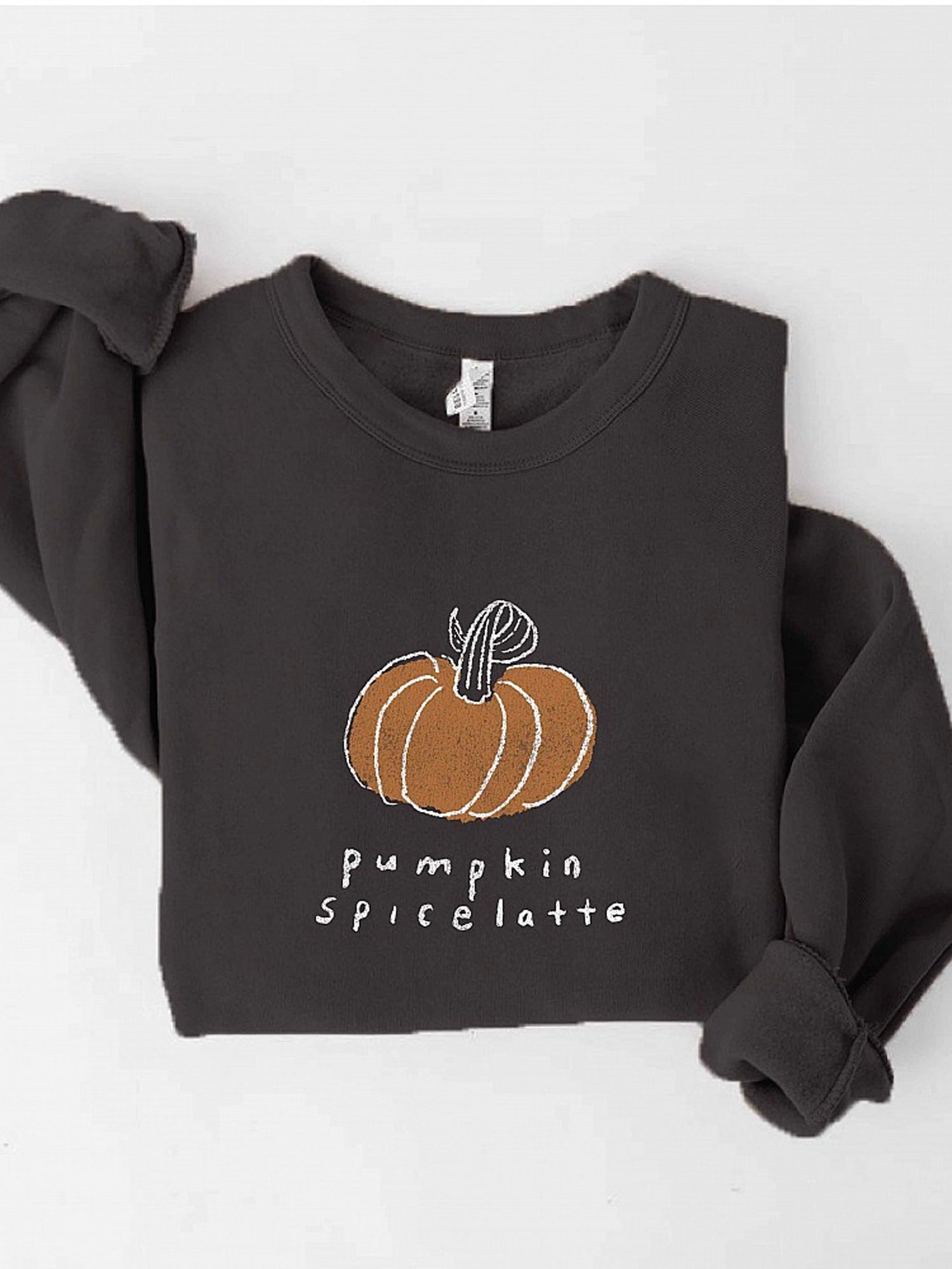Dark sweatshirt with "pumpkin spice latte" text and orange pumpkin graphic. Cozy fall fashion piece.