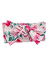 Floral headband with a large bow, featuring pink and green roses on a light background. 