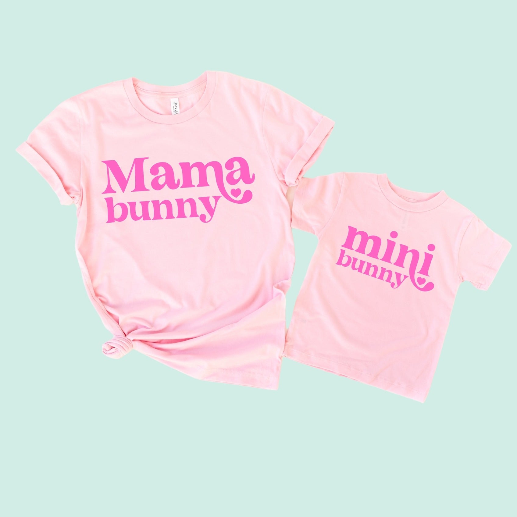 Matching pink "Mama bunny" and "mini bunny" t-shirts for moms and kids. Fun and stylish for family outfits.